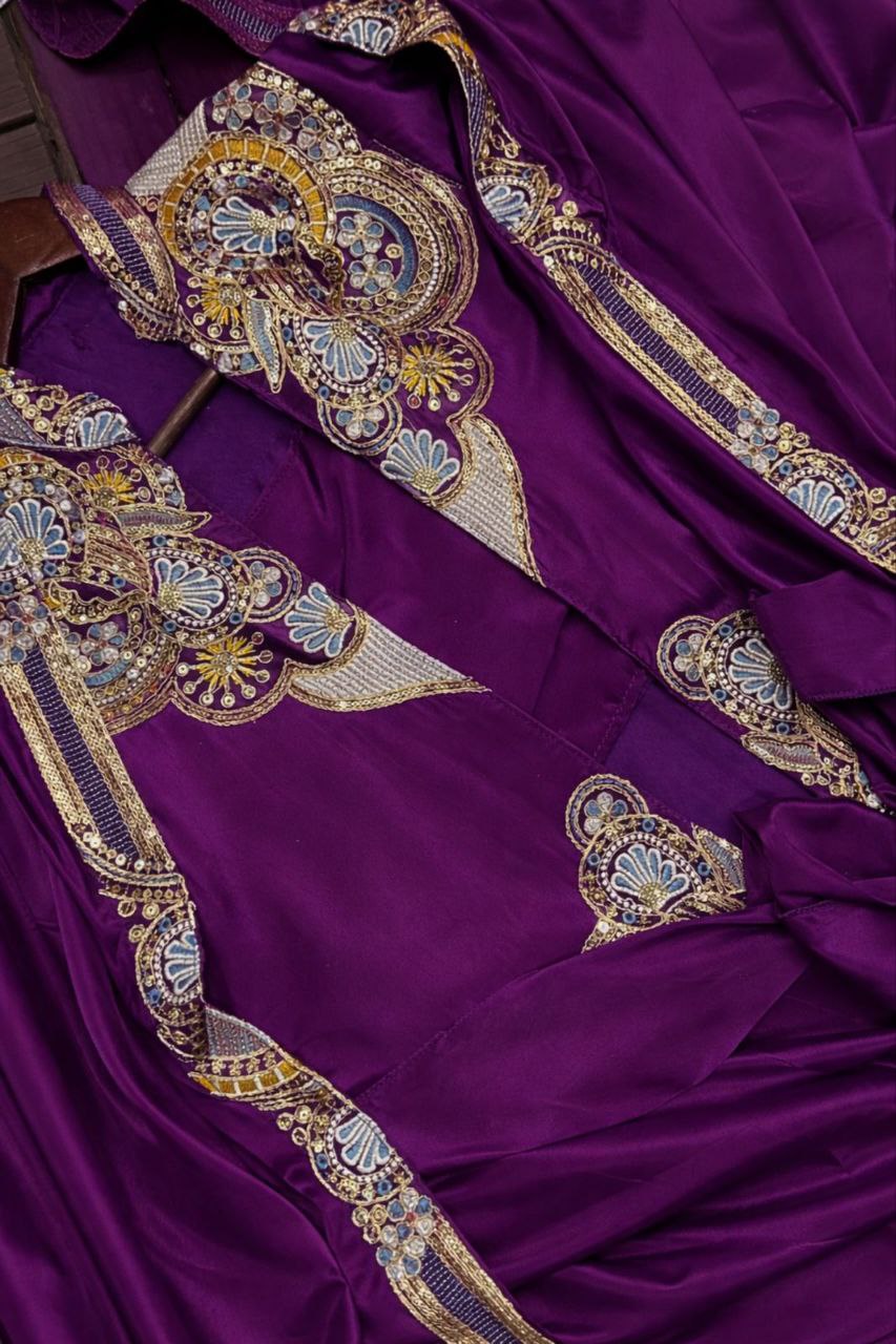 Purple fabric with intricate gold and silver embroidery