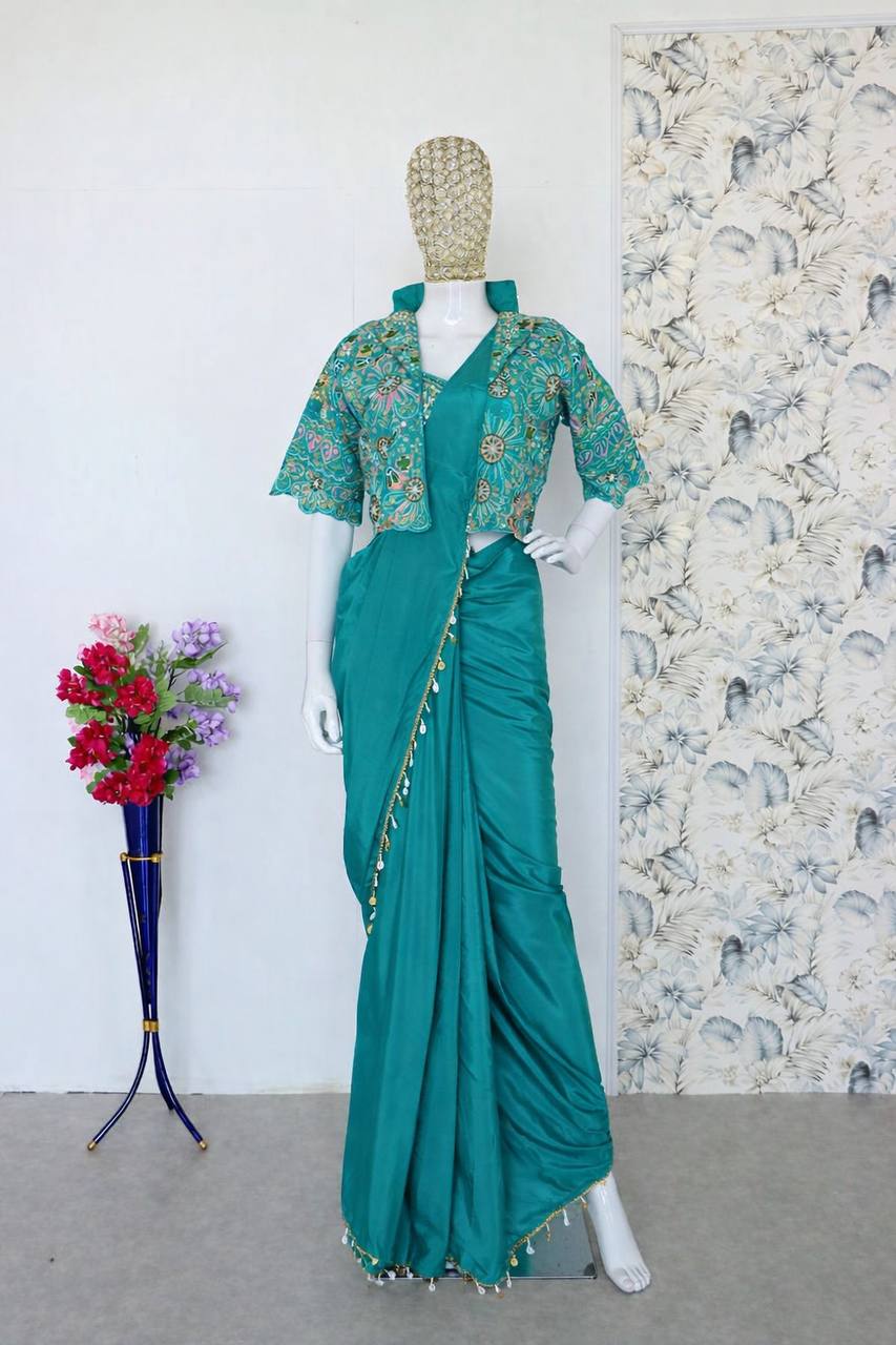 green saree with mirror work blouse and coin border