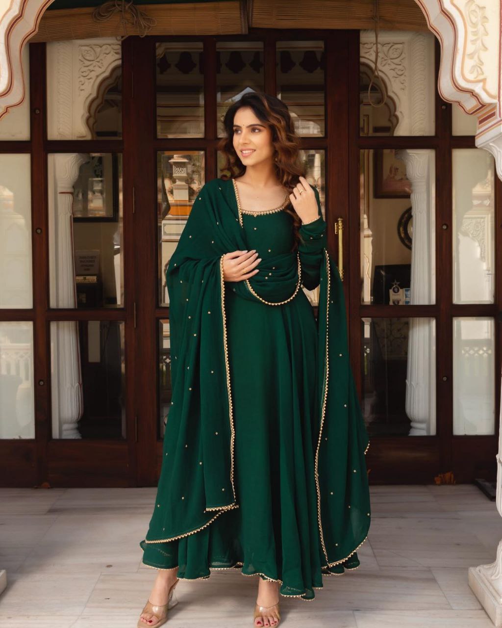 Woman in a green traditional outfit 