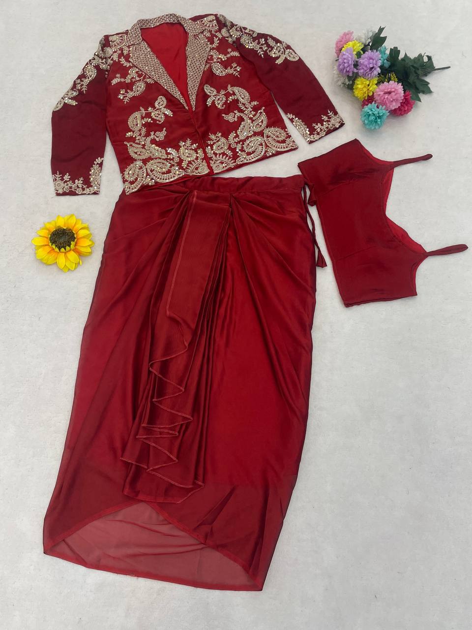 Red traditional outfit with gold embroidery design.