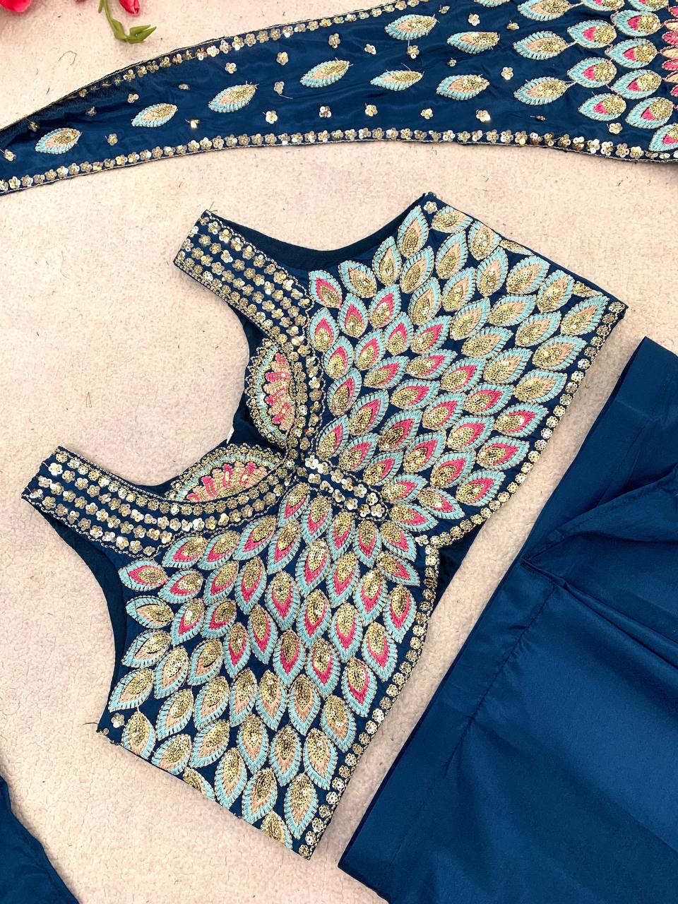 Blue embroidered blouse with intricate patterns