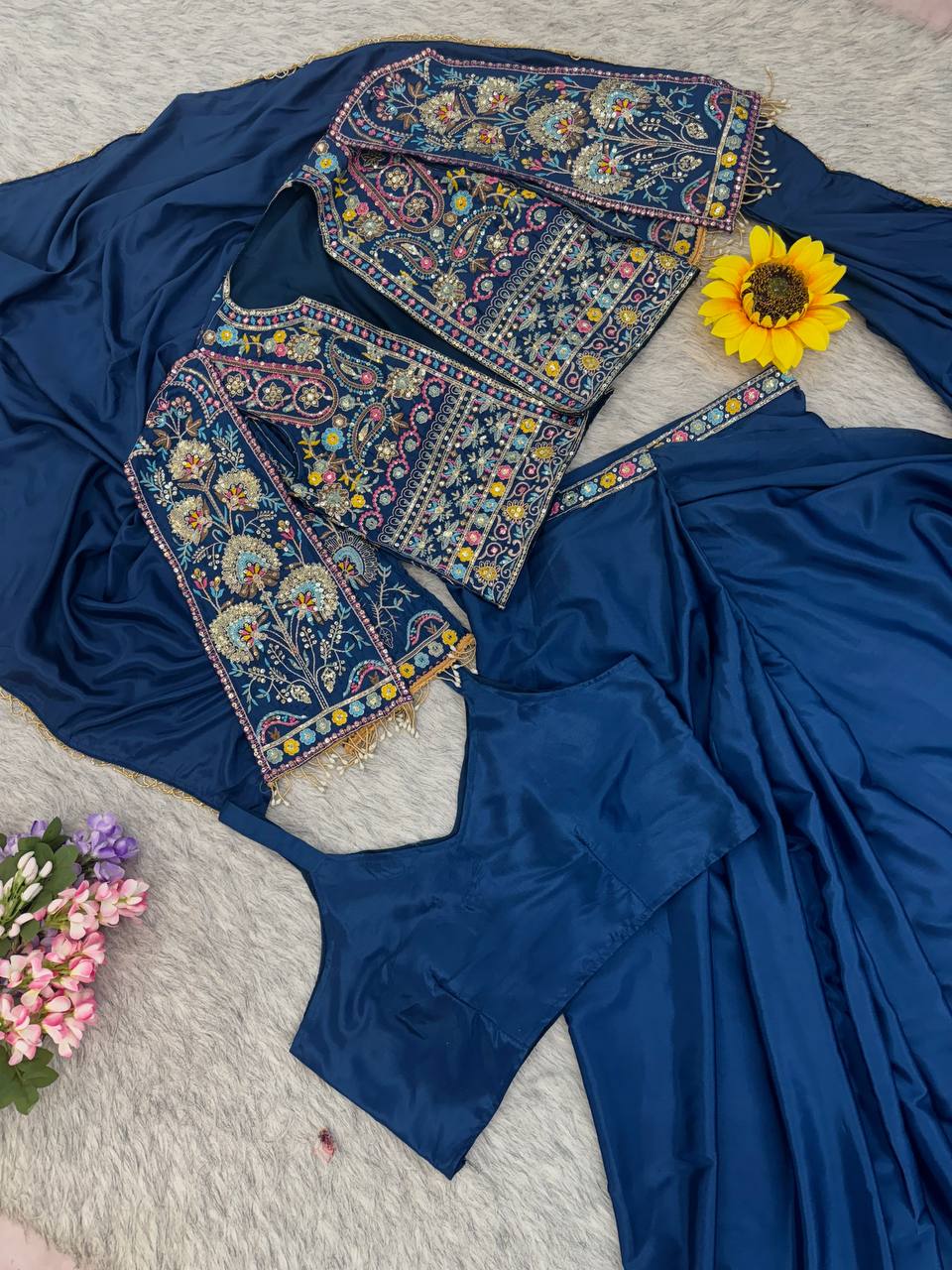 A royal blue saree outfit  heavily embroidered multicolor neckline and sleeve 